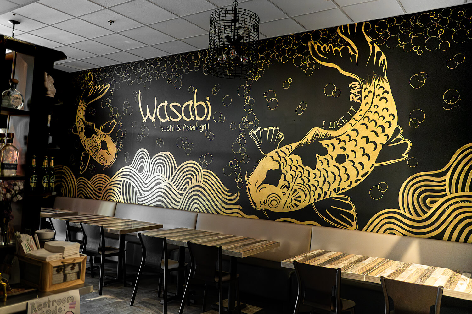 Two fish swimming mural at Wasabi Sushi & Asian Grill